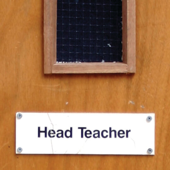 This Head Teachers door has been heavily scuffed and battered